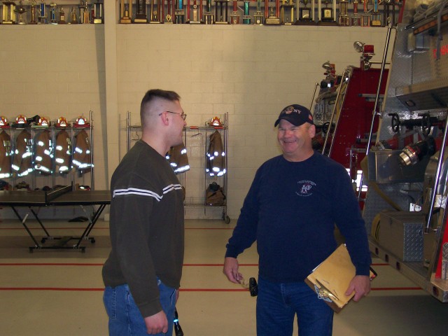 Firefighter/EMT Bret Krabbe (left) and Captain Barnes converse on drill night