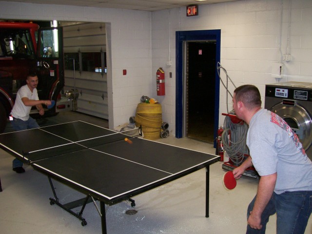 Robert and Troy in a fierce Ping Pong game