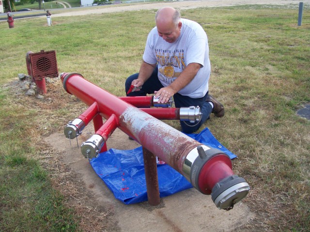 Past President Wilkerson doing some touch up work