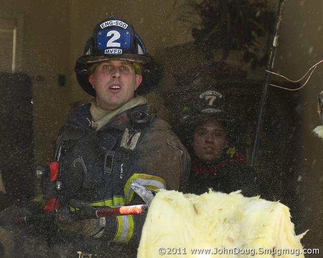 Firefighter/EMT Krabbe overhauling