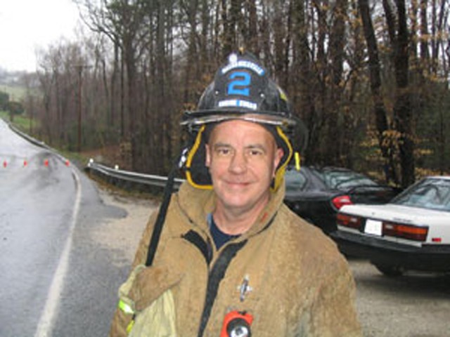 Tom &quot;Blue&quot; Clark takes time to pose real quick on the scene of an MVC.