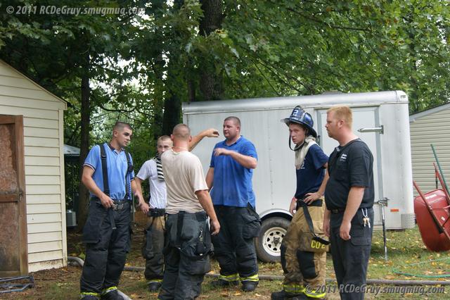 Members converse after a fire 