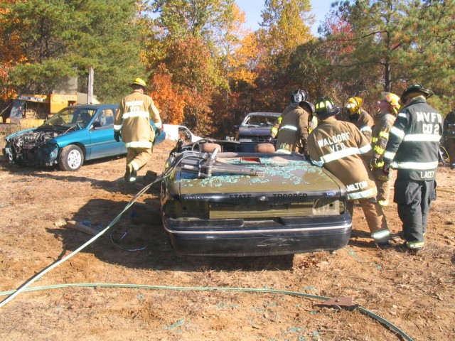 Firefighter 2 Class practices extrication techniques on an old Maryland State Police cruiser