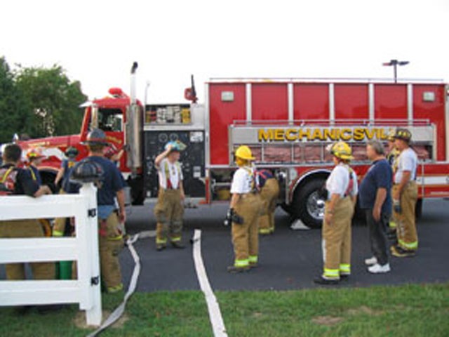 Water Supply Officer Guyther teaching Foam Ops on drill night.