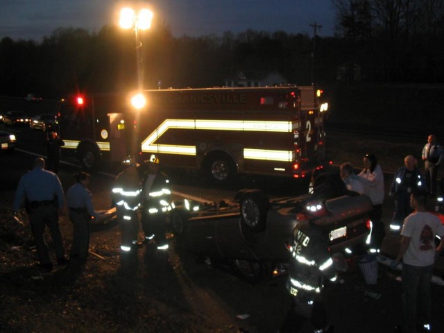 Rescue Squad 2 works an overturned vehicle on the Three Notch Road 