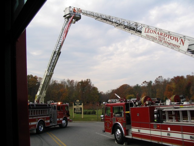 Engine-21 travels under the arch making its way into the cemetary