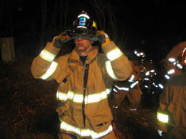 Firefighter/EMT Chris Murray, down visiting from New York, trying to hide behind a prusik cord 