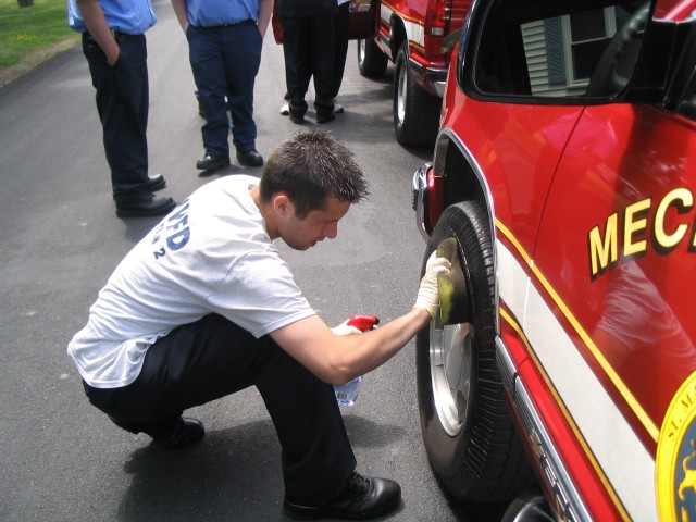 Lieutenant Hemming putting the final touches on Car-2 before the parade