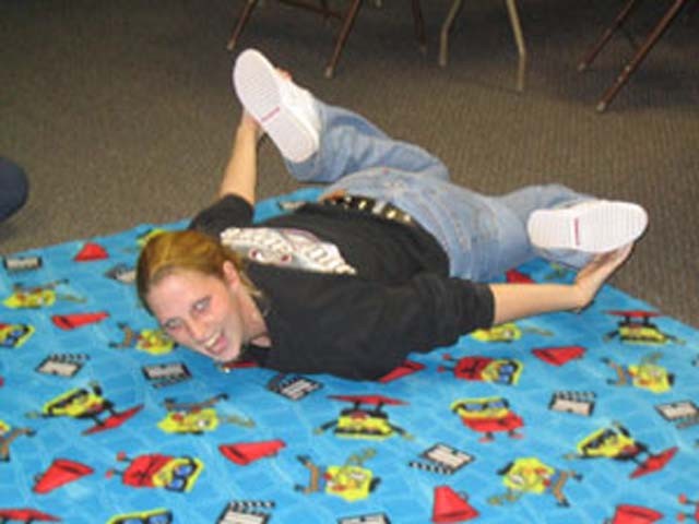 Katie tries to play twister on a blanket! 