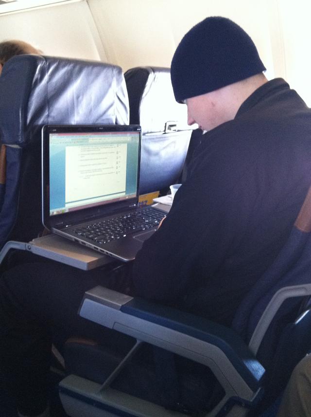 Lieutenant Bryant studying while flying out to Pierce Manufacturing to look at the new Squad 2