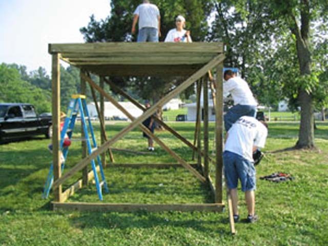 True teamwork being displayed building the roof simulator.