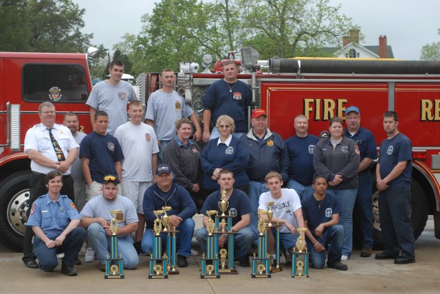 Posing with the eight trophies won at the Southern Maryland Convention and old Engine 222, which participated in its last parade