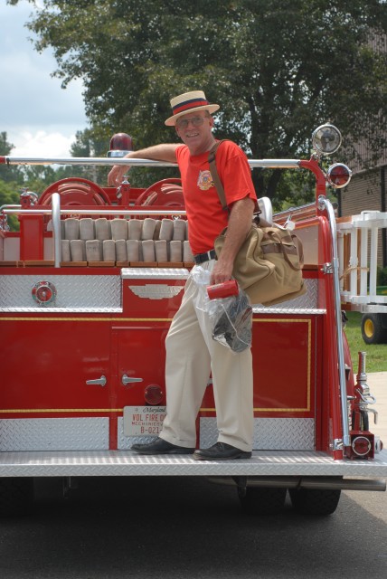 Life/Board Member Henry Fowler poses on the tailboard of Old Engine 1