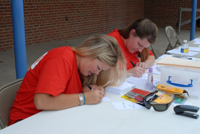 Leah and Brandi at the registration table during the 75th Parade