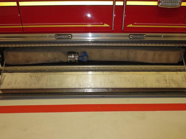 Drivers side underbody compartment houses the 3&quot; fill line and hydrant wrench