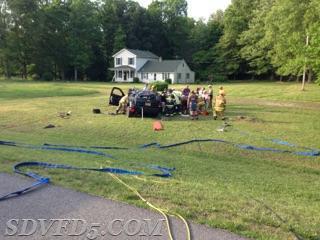 Crews operate on this rollover that seriously injured the occupant on Budds Creek Road.