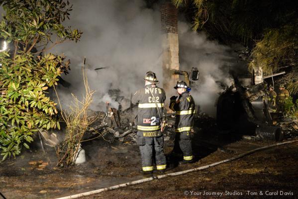 Firefighters operate on the scene of this well involved house fire in the 5-09 Box off of Grampton Road