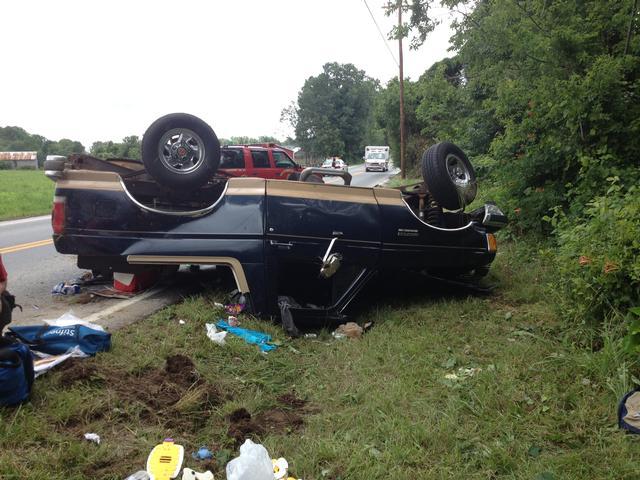 Units operate on this serious rollover on Thompson Corner Road