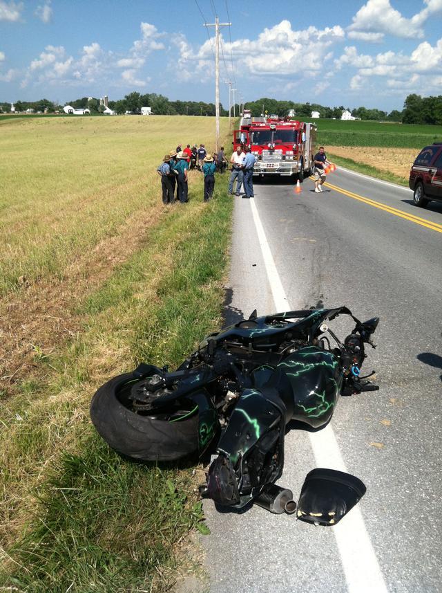 Units operate on the scene of a motor vehicle accident on Thompson Corner Road involving a motor-cycle